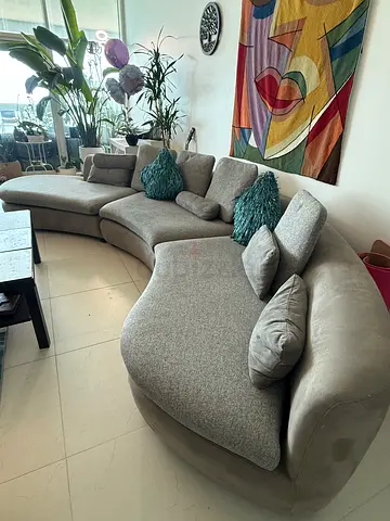 Curved grey sectional sofa - spacious 6-seater, good condition. Each of the three pieces can be sepa