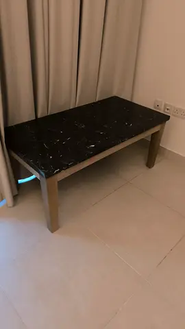 Small black marble-top bench/coffee table in good condition