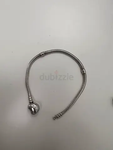 Sterling silver snake chain bracelet with round clasp and heart charm