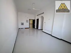 Annual apartment for rent in Al Rawda 3, Ajman. Two bedrooms, living room, 2 bathrooms, central AC,