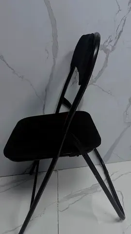 Black folding chair with padded seat and back - good condition. From Homes R us