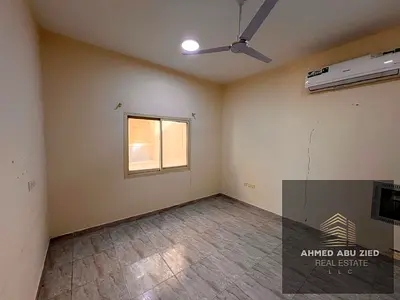 For rent: A spacious unit featuring a bedroom, a living room, two bathrooms, and a balcony. It boasts a prime location in Al Aliya, close to amenities