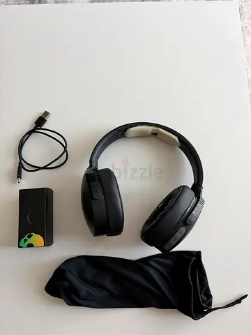 Wireless over-ear Bluetooth headphones with carry pouch and charging cable