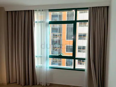 Neutral grey blackout curtains with sheer panels - set for large window