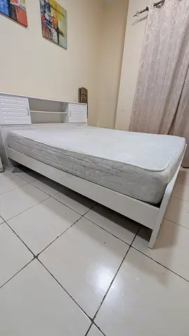 White wooden queen bed frame with mattress  4 seater dining table
