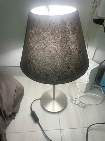 Simple gray fabric bedside table lamp with metal base