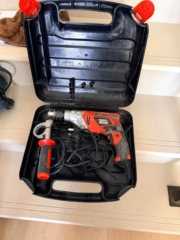 Black  Decker corded hammer drill with case and side handle - used