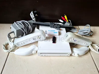 Nintendo Wii with all cables, 2 controllers and more than 50 games