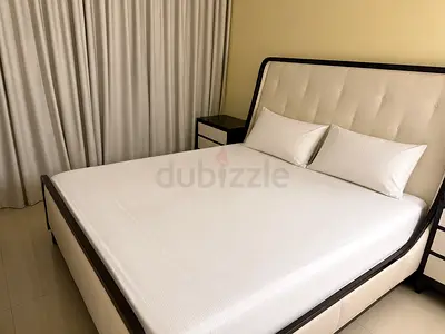 Queen upholstered bed frame with headboard and storage base - cream