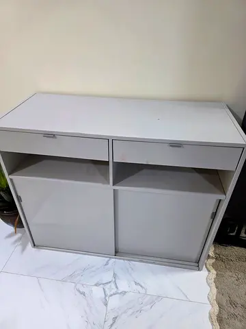 White Wooden Storage Cabinet with Sliding Doors and Drawers IKEA.