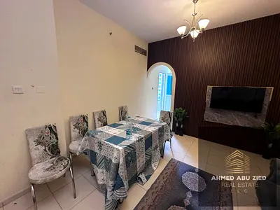 Luxury fully furnished 1BR apartment with sea‑view balcony in Orient Towers, Ajman. Features a mast