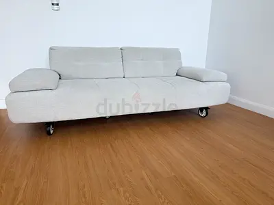 Light grey 3-seater sofa with wheels - good condition