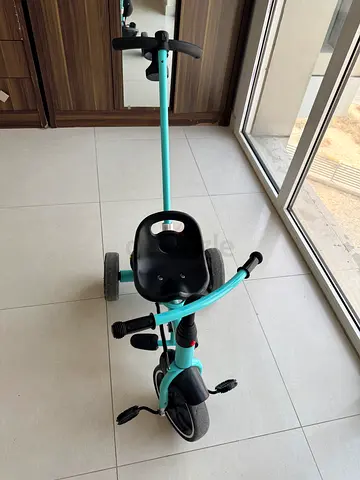 Used toddler tricycle with push handle - good condition