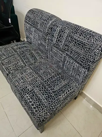 Pair of armless patterned accent chairs — good condition. No major issues