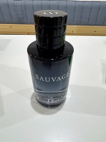Dior Sauvage Eau de Parfum bottle (partially used)