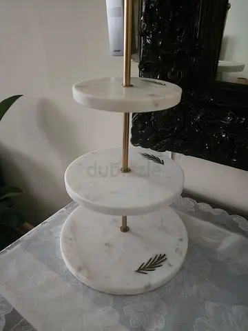 Three-tier white marble side table with brass accents