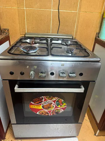 50 AED ONLY Used 4-Burner Stainless Steel Gas Cooker with Oven - Good 3 Working Condition