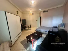 Luxury furnished studio in Orient Towers with gym, pool, free parking, open-view balcony, semi‑sep