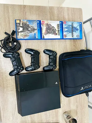 PS4 console bundle with 3 controllers, 3 games and carry case