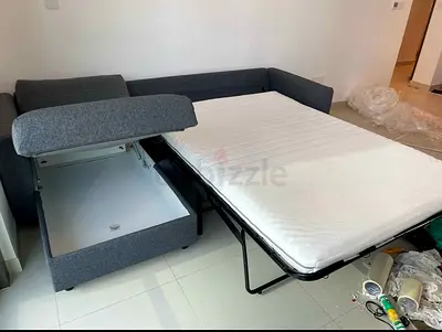 Grey L-Shaped Sofa Bed with Storage and Mattress