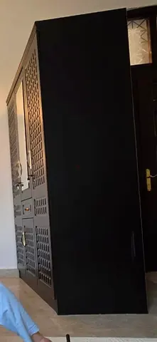Modern Black Wardrobe with Decorative Lattice Pattern