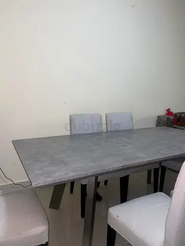 Modern grey dining table with 4 upholstered chairs - good condition