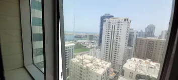 Luxury two-bedroom apartment with sea view for annual rent in Sharjah, Al Majaz 1, featuring a large
