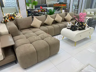 L-shaped tufted fabric sofa with chaise - neutral beige