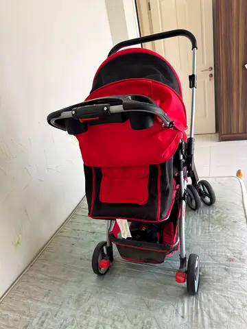 Red baby stroller / pram for sale