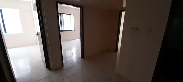 Two bedrooms and a living room for annual rent in Sharjah, Al Majaz 1 | Comfortable interior spaces | Two bathrooms | Suitable for families and employ