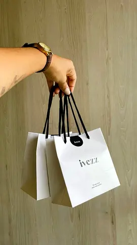 Set of 3 small white IVezz paper shopping bags with black handles - lightly used