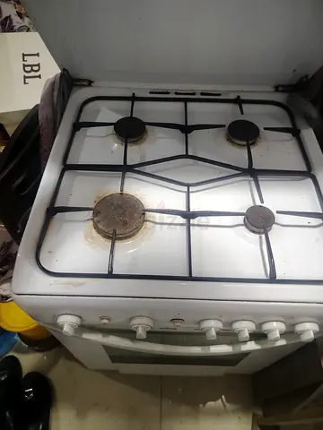 Cooker with electric oven