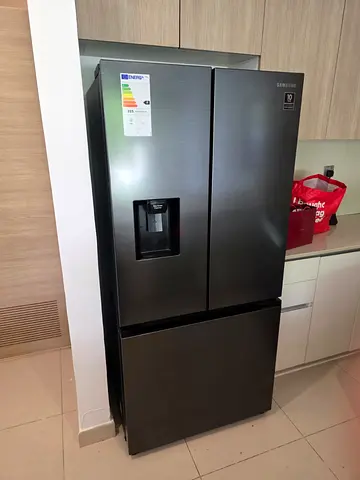 Samsung French door fridge and freezer new model slightly used with water dispenser