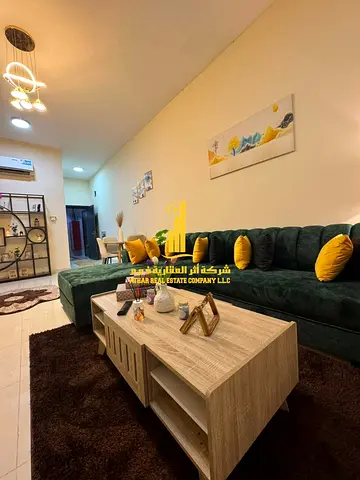 Furnished one-bedroom apartment with new furniture for monthly rent in Ajman - Al Rawda 2 - Sheikh Ammar Street