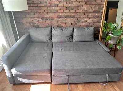 Grey L-Shaped Sofa Bed with Pull Out Section