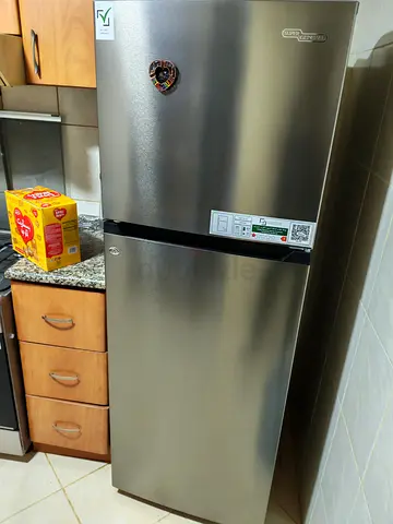 Silver double-door refrigerator in good working condition