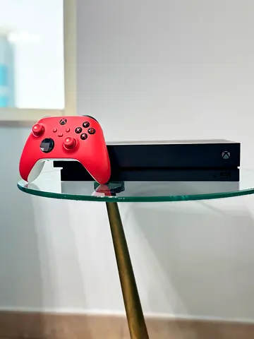 Xbox One X console with red Xbox Wireless Controller - good condition. Price Negotiate able.