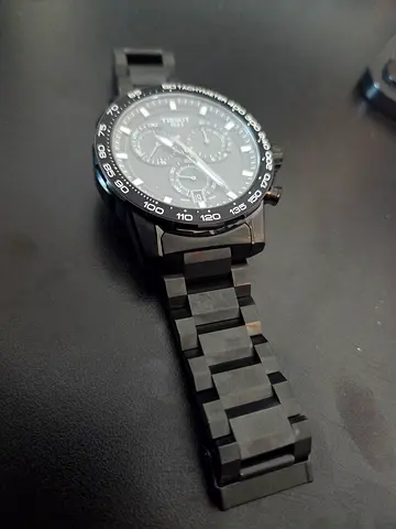 Black mens chronograph wristwatch with metal bracelet