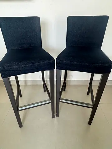 Pair of black upholstered bar stools with backrest - used with normal wear and tear