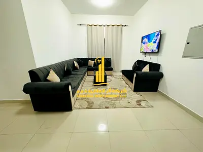 Luxury two-bedroom apartment with a living room and balcony. Ajman, Al Nuaimiya 2. Fully furnished for monthly rent.