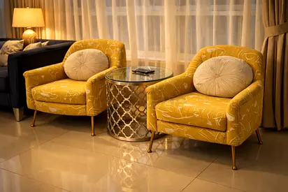 Pair of mustard yellow accent armchairs with cushions — excellent condition