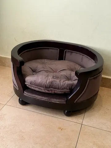 Wood-framed cozy pet bed with cushion (good condition)