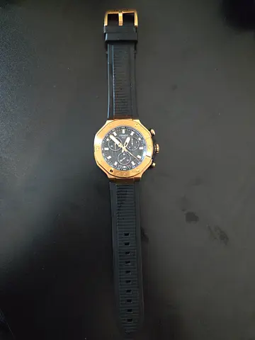 Mens black sport chronograph watch with gold-tone bezel