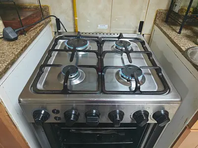 Used 4-Burner Gas Oven Stove in Stainless Steel - Working Condition
