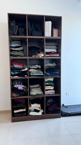 15 shelved clothes open cabinet
