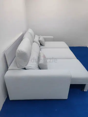 Light grey ikea Eskilstuna sofabed with storage