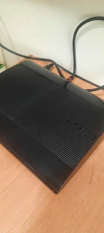 Sony PlayStation 3 Slim console with controller and games