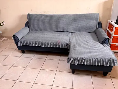 L-shaped sofa with chaise — good condition, grey slipcovers included