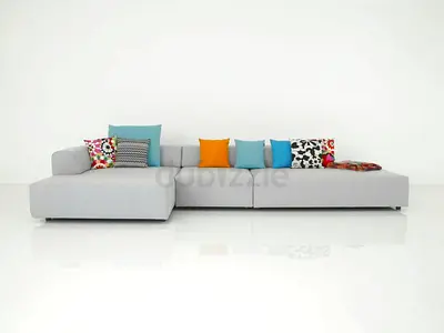 Light grey modern L-shaped sectional sofa with colorful cushions