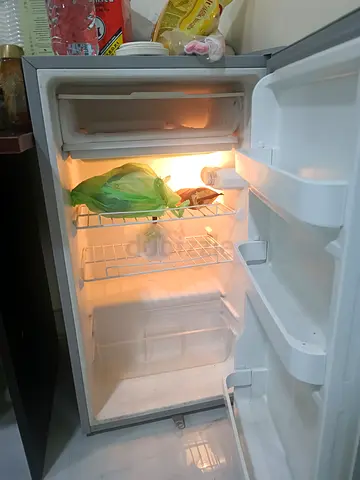 Compact single-door fridge with small freezer - good working condition